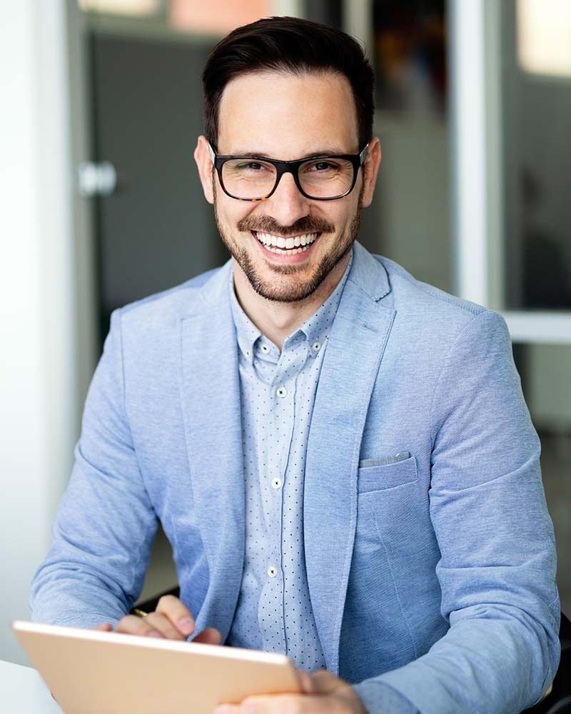 portrait-of-handsome-successful-businessman-holdin-LLMNZ58.jpg